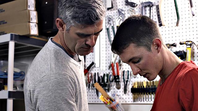 Watch this dominant dad take control and fuck his eager son at the workbench