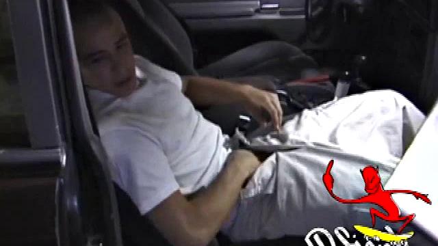 Bradley Shaw finds the passenger seat of a black sedan for some private time. Since the car is parked in the garage, Bradley has positioned a TV with VCR so his porn can keep him stimulated.