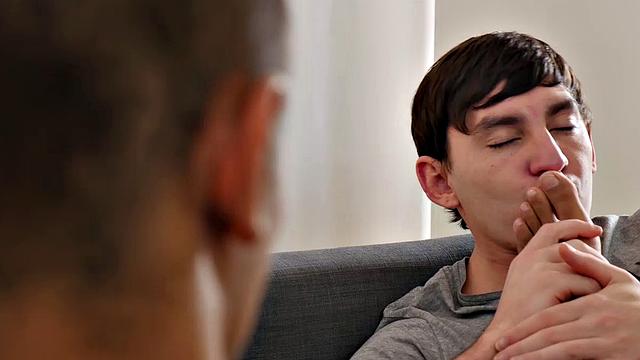 Martin and James are kissing on the sofa, when James starts to suck Martin's toes. The boys undress and more toe sucking takes place. Once both are naked, Martin starts sucking James off.