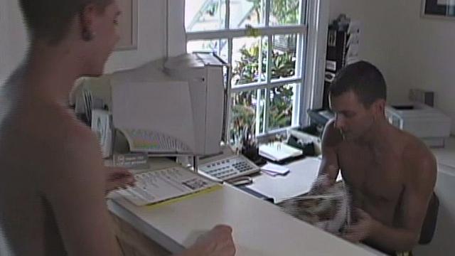 We look in on 21 year old Joey Landis, who is working the front desk when 19 year old Blake Ashton comes to say hello. When Blake leaves, he starts flirting with Joey through the window. Joey responds by stripping down and stroking his big hard dick.