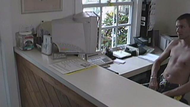 We look in on 21 year old Joey Landis, who is working the front desk when 19 year old Blake Ashton comes to say hello. When Blake leaves, he starts flirting with Joey through the window. Joey responds by stripping down and stroking his big hard dick.