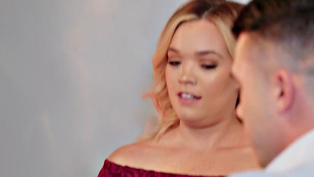 Horny stud pounds hairy MILF's pussy in doggystyle while wearing a skirt and a t-shirt