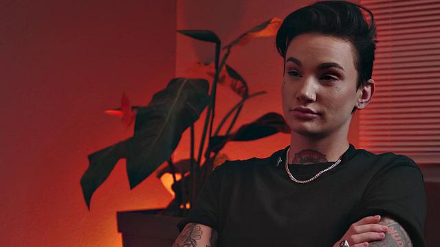 Religious genderfluid person with priest