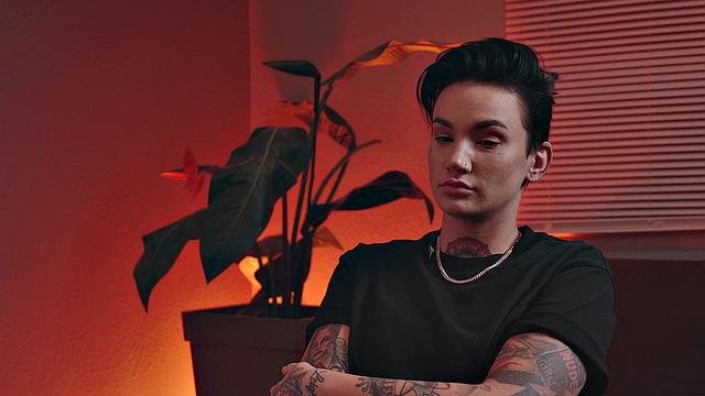 Religious genderfluid person with priest