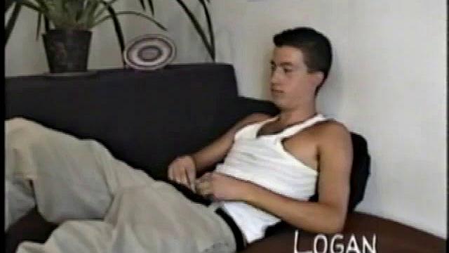 Logan gets on knees, pulls shirt up, yanks on cock. Then slips off boxers, thrusts butt in the air.