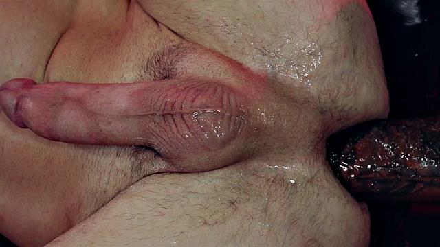 Ebony jock fists BDSM stud after whipping