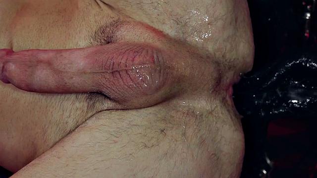 Ebony jock fists BDSM stud after whipping