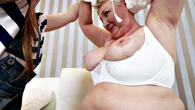 Tattooed brown-haired dyke devours her man's meat while he watches