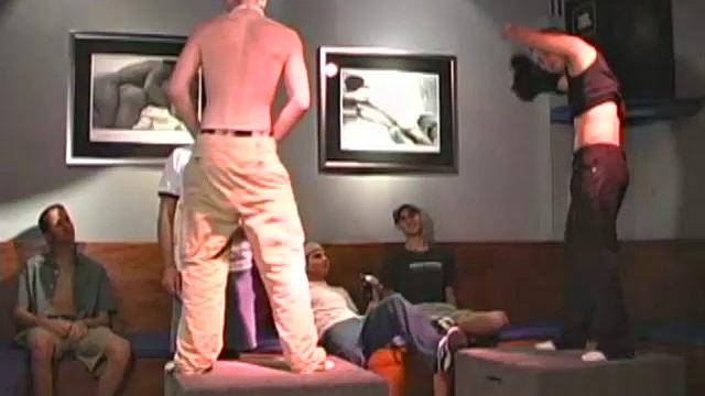 Evan and Zachary are stripping naked and dancing at the local bar, surrounded by fans.