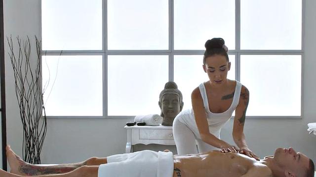 Oiled masseuse enjoys passionate sex on massage table