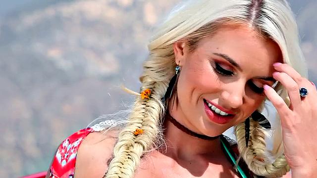 Blonde bombshell in the desert gets off with her thong & boots on!