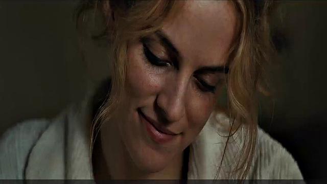 Blonde celebrity Riley Keough gets naughty in public with a topless bra-clad scene