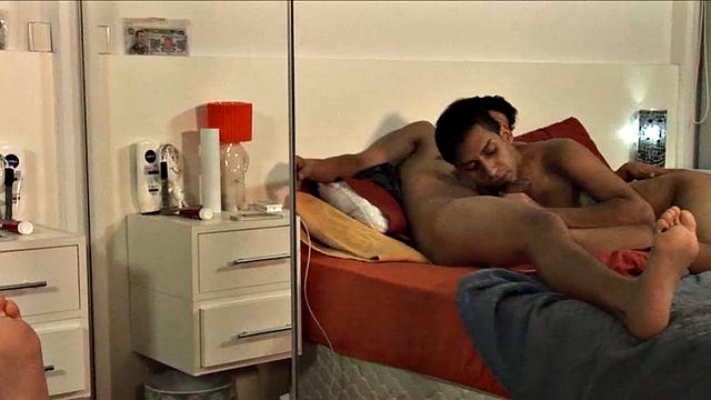 We join these two young Latinos making out on the bed, and by the time both are stripped to their underwear, Jonas pulls his big uncut dick out for Alejo to suck on.