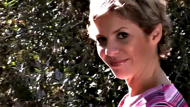 Busty blonde MILF gets naked outdoors