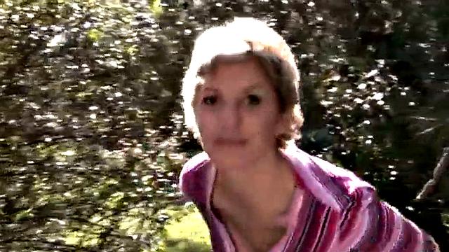 Busty blonde MILF gets naked outdoors