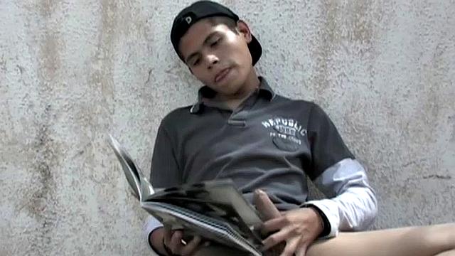 Carlos spots Anguel beating off to a porn magazine and decides to join him. Seated next to each other, with pants off and cocks hard, it isn't long before the magazine is no longer required.