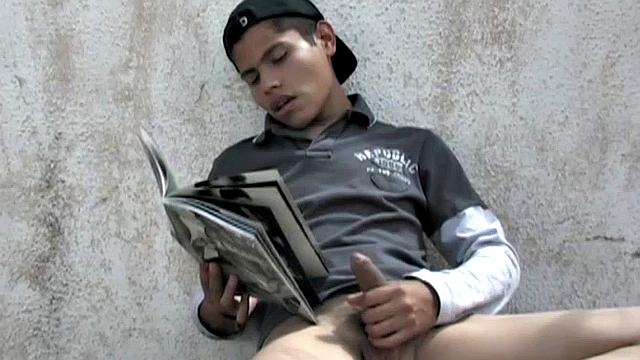 Carlos spots Anguel beating off to a porn magazine and decides to join him. Seated next to each other, with pants off and cocks hard, it isn't long before the magazine is no longer required.