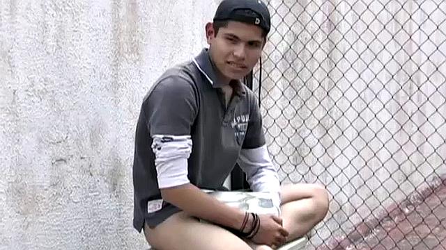 Carlos spots Anguel beating off to a porn magazine and decides to join him. Seated next to each other, with pants off and cocks hard, it isn't long before the magazine is no longer required.