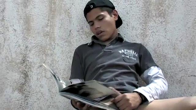 Carlos spots Anguel beating off to a porn magazine and decides to join him. Seated next to each other, with pants off and cocks hard, it isn't long before the magazine is no longer required.