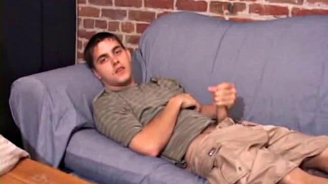 While T.J. Kummings strokes his hard cock on the sofa, he lets a helping hand plug up his butt with dildos. Butt play turns to cock play, as he gets a hand job and blows a big warm load.