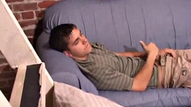 While T.J. Kummings strokes his hard cock on the sofa, he lets a helping hand plug up his butt with dildos. Butt play turns to cock play, as he gets a hand job and blows a big warm load.