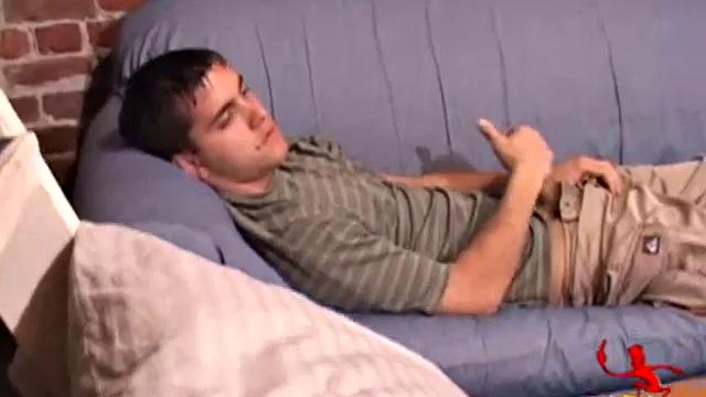 While T.J. Kummings strokes his hard cock on the sofa, he lets a helping hand plug up his butt with dildos. Butt play turns to cock play, as he gets a hand job and blows a big warm load.