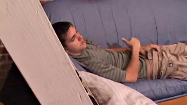 While T.J. Kummings strokes his hard cock on the sofa, he lets a helping hand plug up his butt with dildos. Butt play turns to cock play, as he gets a hand job and blows a big warm load.