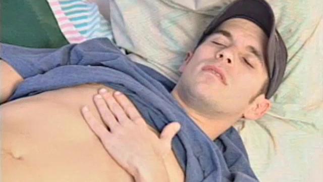 After getting off the phone, 21 year old frat boy Sean Storm feels the urge to jack off, instead of study. He pushes the books aside and starts rubbing his package. Then he slowly removes his shirt to reveal an awesome six pack.