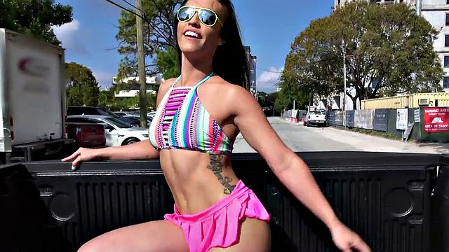 Watch this perky teen with glasses give a public handjob to a massive cock in a car
