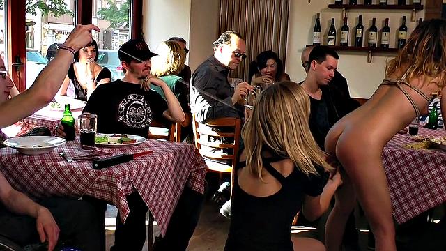 Kinky tattooed slut in bondage sucks and fucks in public eatery