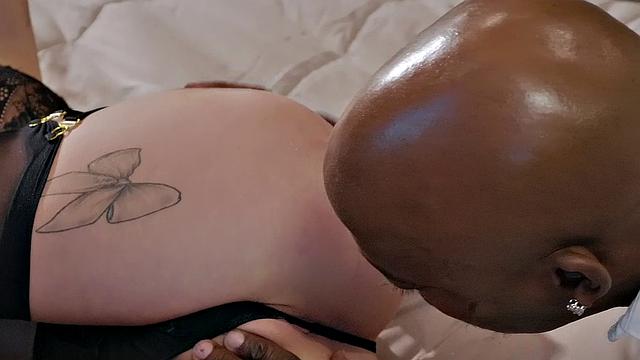 Curly-haired babe in stockings gets her mouth and pussy stuffed with a big black cock