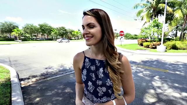 A tattooed amateur brunette gag on a hard cock in the outdoors