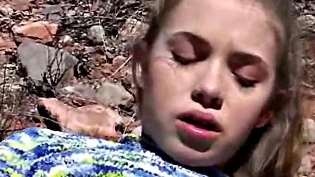 Little April rubs her tight pussy in the open air