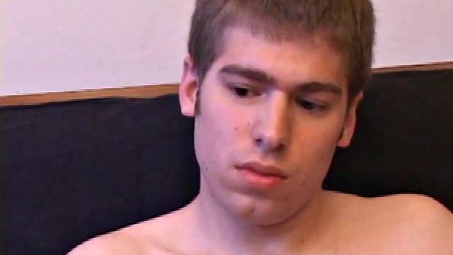 Adam Turner strips naked and grabs lube, as he checks out the porno video that's playing. He works up a boner and strokes with determination until his cum starts pumping.