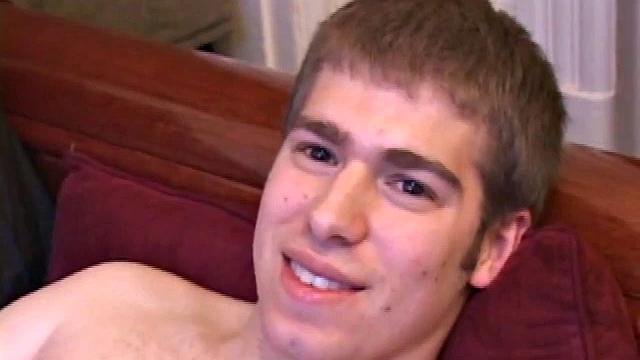 Adam Turner strips naked and grabs lube, as he checks out the porno video that's playing. He works up a boner and strokes with determination until his cum starts pumping.