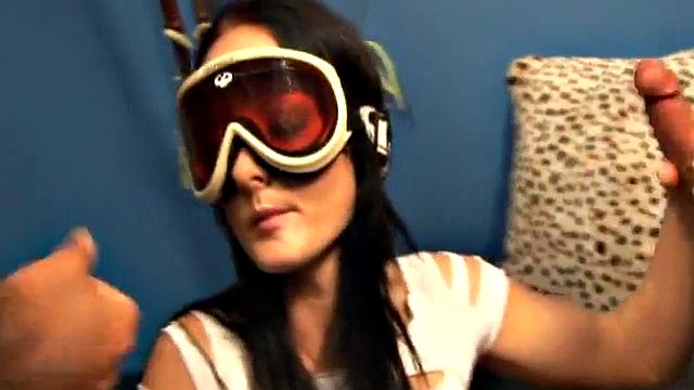 Brunette girl with sky glasses strokes two big dicks