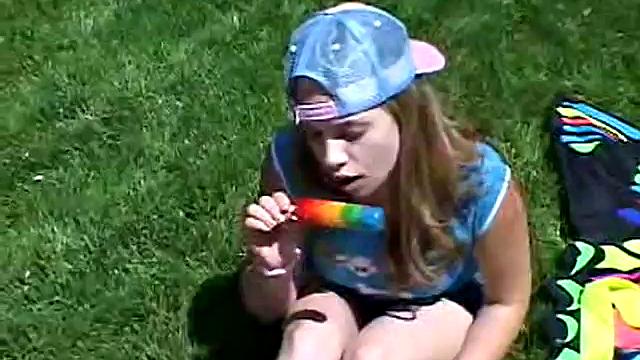 Cute April Outdoors Sucking A Popsicle