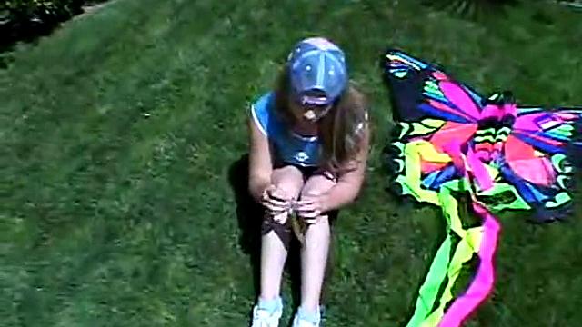 Cute April Outdoors Sucking A Popsicle