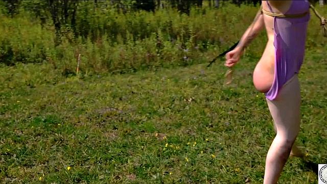 Piss drinking beauty flogged in sunny day domination ballet