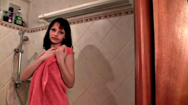 Petite teen touches herself in the shower