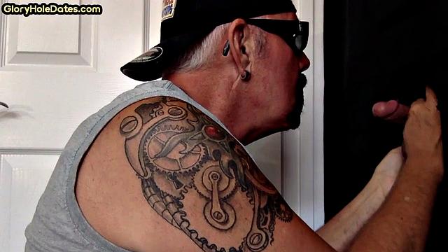 Gloryhole DILF sucks cock and swallows cum in video