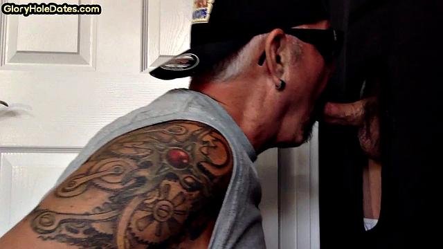 Gloryhole DILF sucks cock and swallows cum in video