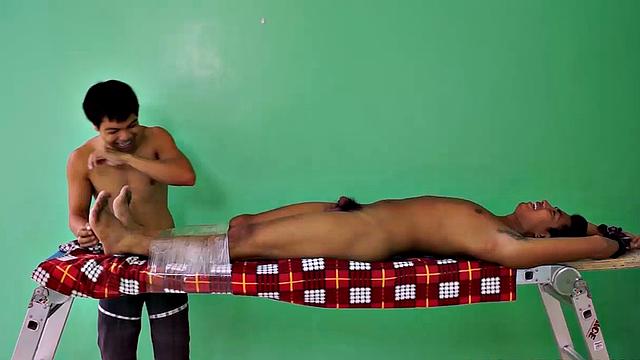 Hot and sexy Asian boy Josh discovers his kink as he is strapped down on the tickle rack for a session he won't forget. Josh discovers he loves being tickled and fantasizes about being in a dungeon.