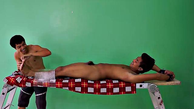 Hot and sexy Asian boy Josh discovers his kink as he is strapped down on the tickle rack for a session he won't forget. Josh discovers he loves being tickled and fantasizes about being in a dungeon.