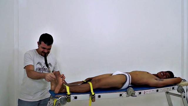 I know it's been a while since I've gotten in front of the camera, but I just had to get my fingers and feathers on this hot and sexy cute Asian boy's awesome smooth ticklish soles! So I strapped this cutie down on the rack and had my tickling