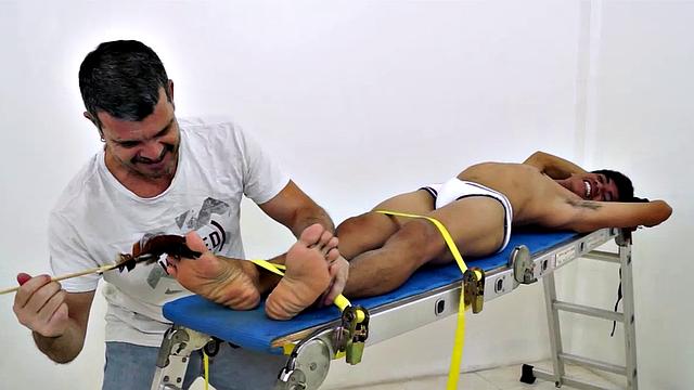 I know it's been a while since I've gotten in front of the camera, but I just had to get my fingers and feathers on this hot and sexy cute Asian boy's awesome smooth ticklish soles! So I strapped this cutie down on the rack and had my tickling