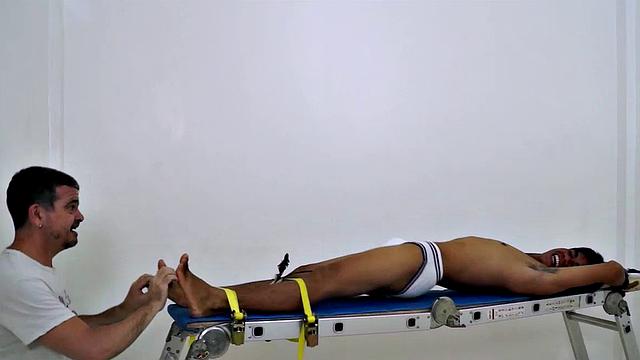 I know it's been a while since I've gotten in front of the camera, but I just had to get my fingers and feathers on this hot and sexy cute Asian boy's awesome smooth ticklish soles! So I strapped this cutie down on the rack and had my tickling