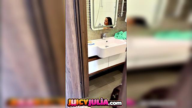 Juicy Julia peeing in bathroom and showing big tits