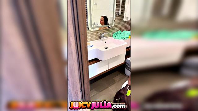 Juicy Julia peeing in bathroom and showing big tits