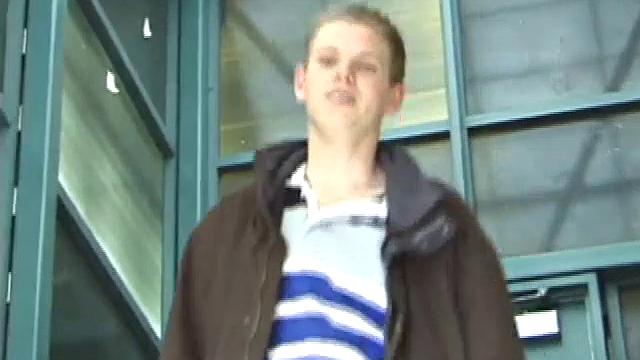 We catch up with Christian on an outdoor stairway. He leads us to a men's room with glory holes. Tere, Christian jacks off to photos in a straight porn magazine.